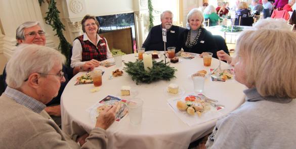 People sitting at a table at an American Village Event